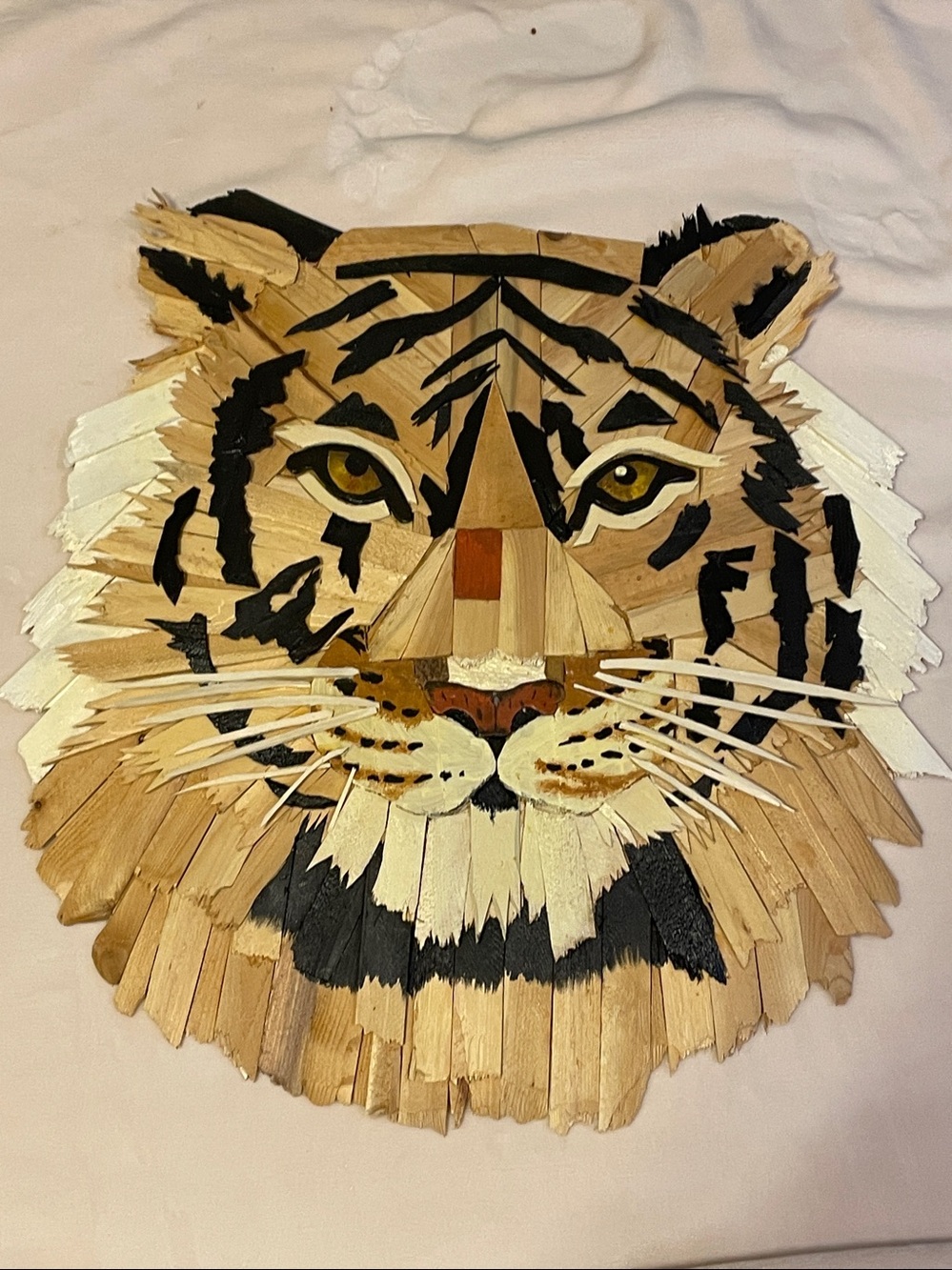 Hand crafted mixed-media collage sculpture of a tiger